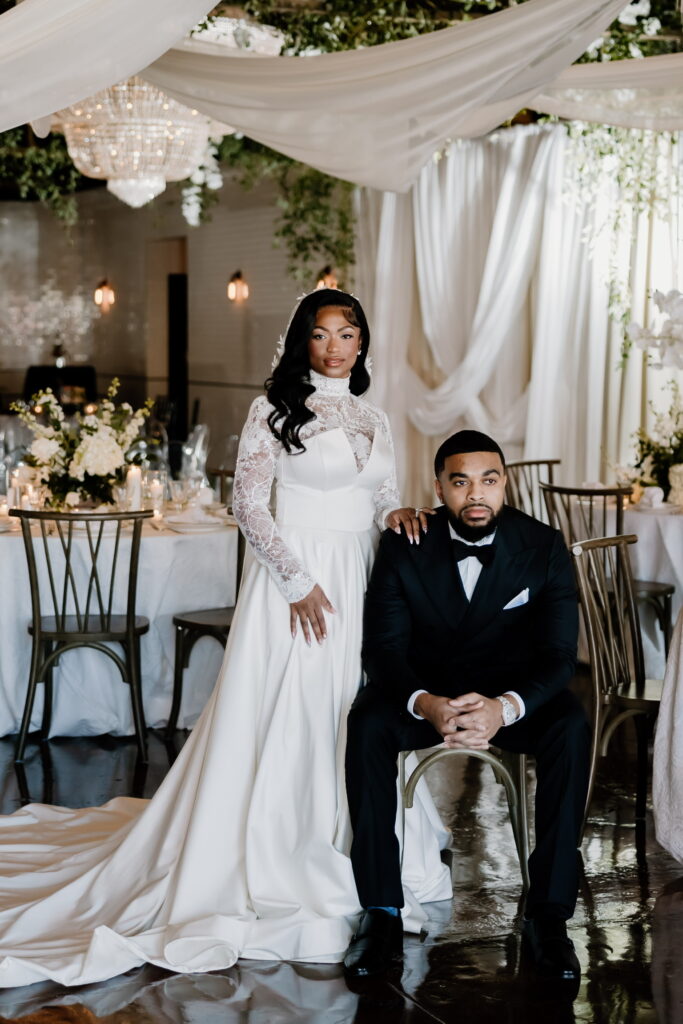 couple standing and sitting posing at the guild in kansas city